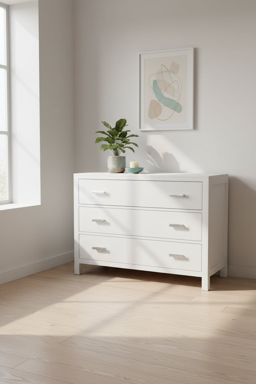 White dresser with four drawers on a white background