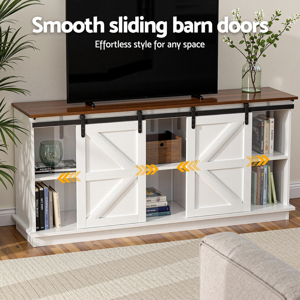 White entertainment console with sliding barn doors in a living room setting.
