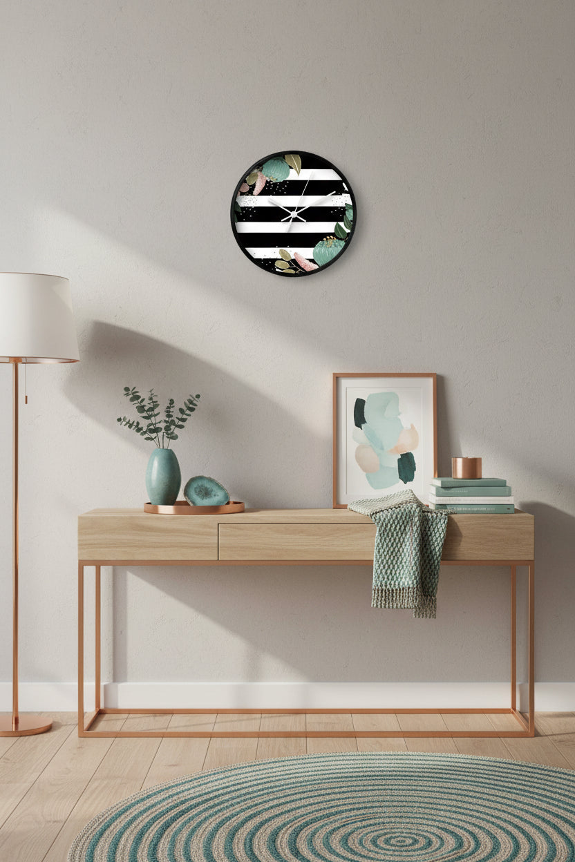 Wall clock with black and white striped design and floral elements on a white background
